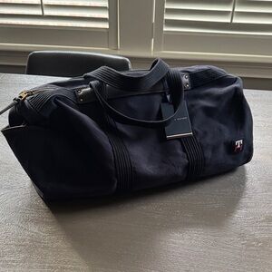 NWT Tommy Hilfiger Navy Canvas Duffle with Black Straps, 19” W x 11” H